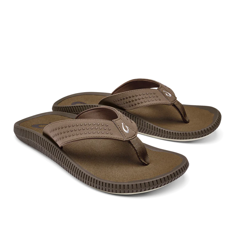 The OLUKAI Mens Ulele Brown sandals feature water-resistant, textured brown straps and soles with a small white logo, designed for comfort and foot pain relief—shown angled on a plain background.