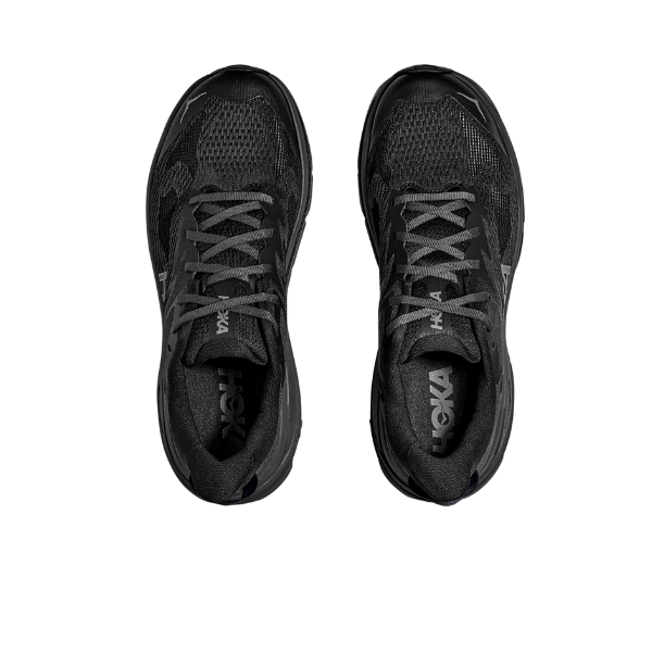 Black running shoes with 'Hoka' branding on a white background