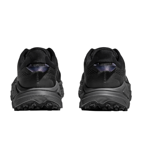 Black hiking shoes with tread pattern on sole on a white background