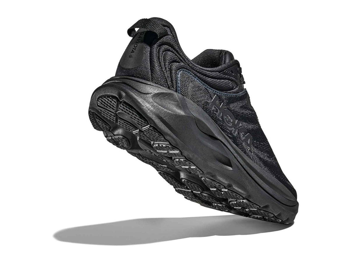 Outsole of the HOKA Women's Gaviota 6 Black/Black running shoe, abrasion-resistant rubber tread.