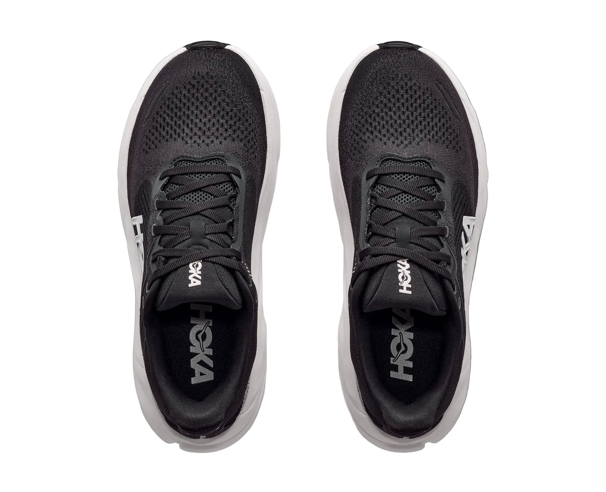 HOKA Men's Arahi 9 Wide Black/White running shoe, white H-Frame midsole and black laces, side profile.