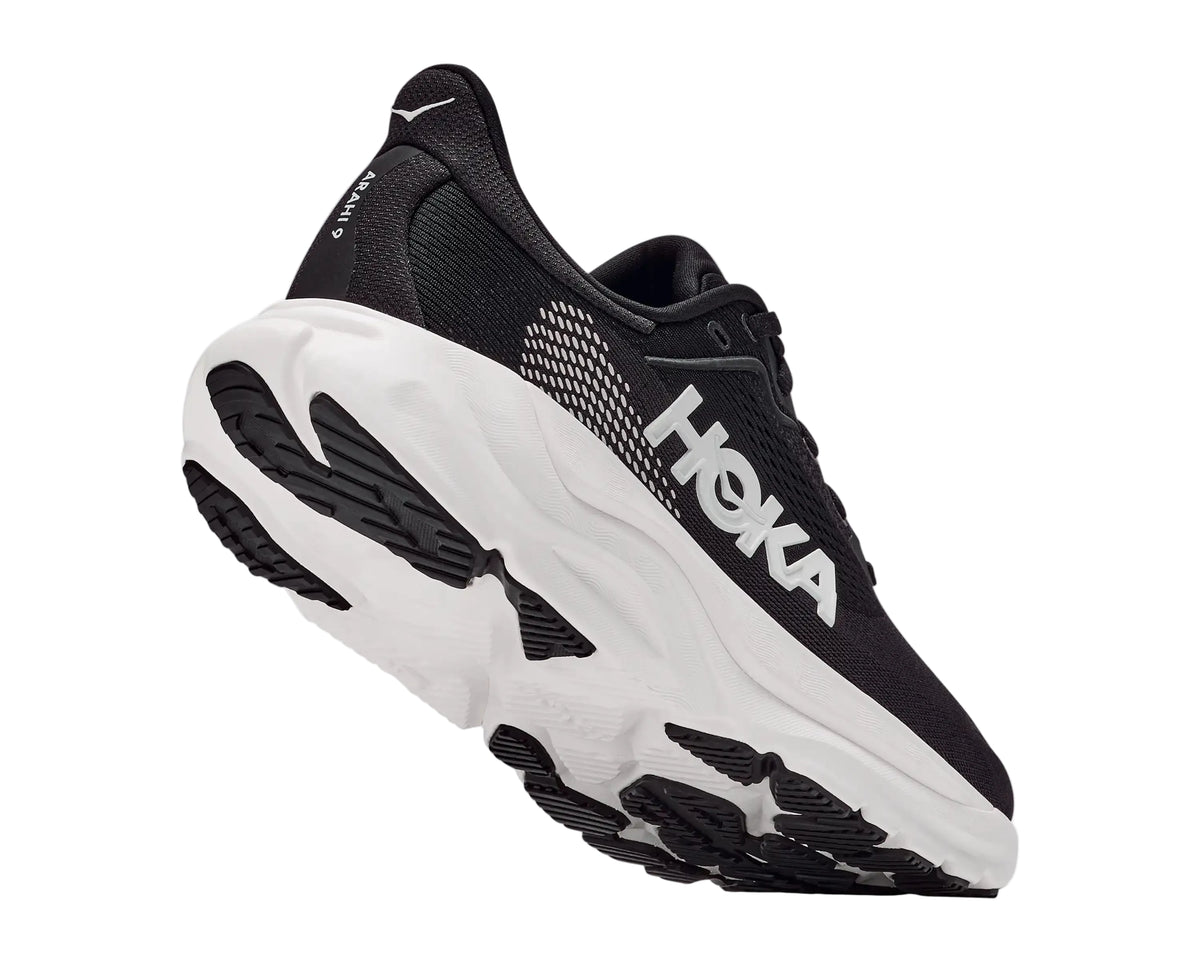 HOKA Men's Arahi 9 Black/White running shoe outsole, podular rubber tread pattern for road running.