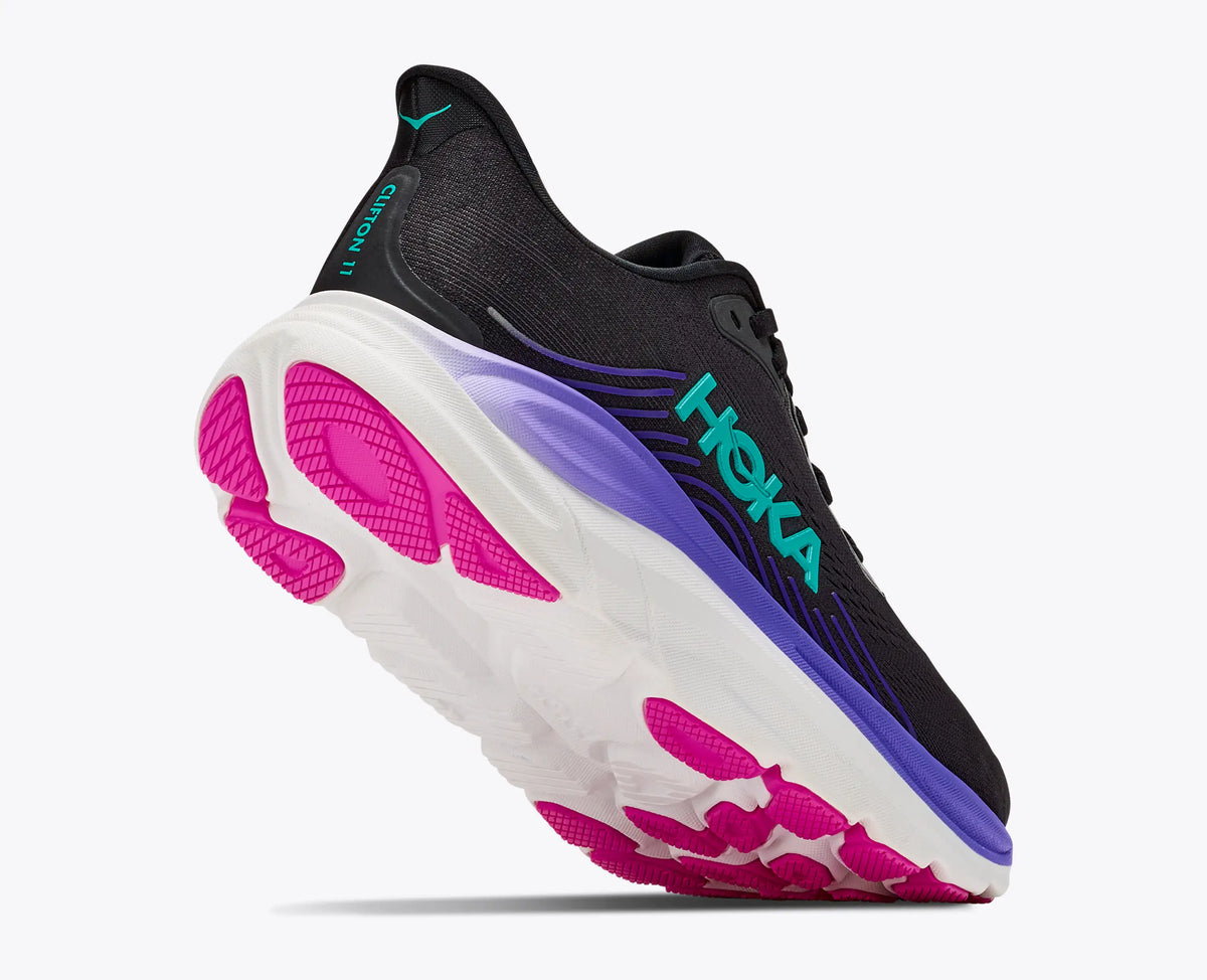 Outsole of the HOKA Women's Clifton 11 Black/Neon Nebula running shoe, abrasion rubber tread pattern.