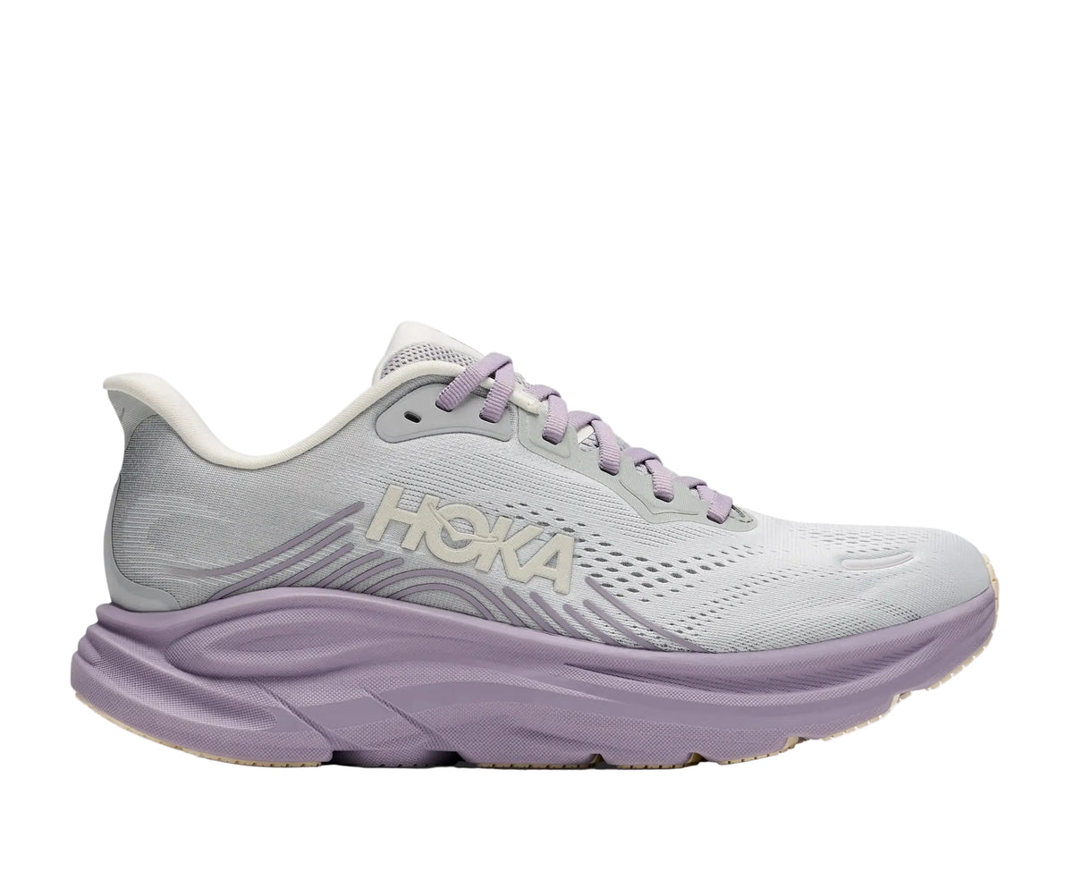 HOKA Women's Clifton 11 Stardust/Mellow Lilac running shoe, pale grey mesh upper, cushioned midsole, angled view.