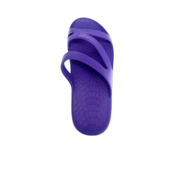 The SOVELLA Sovella Womens PF Slide Purple is a single comfort recovery sandal with arch support, two crossing straps, and a textured sole, shown on a white background.