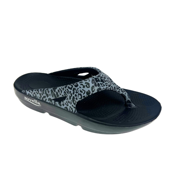 The Sovella Womens PF Thong Black/Leopard is a comfort recovery sandal with a textured sole, gray strap featuring a black leopard print, arch support, and the SOVELLA brand name on the side.