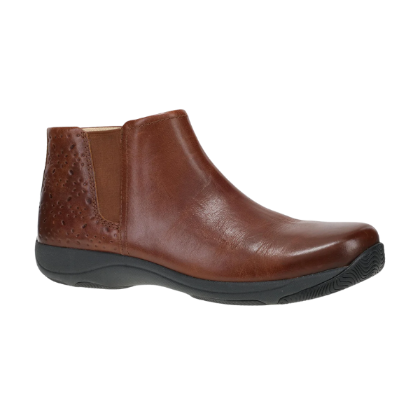 Dansko Women's Sherry Cinnamon bootie in brown leather with arch support, elastic side panel, and textured heel.