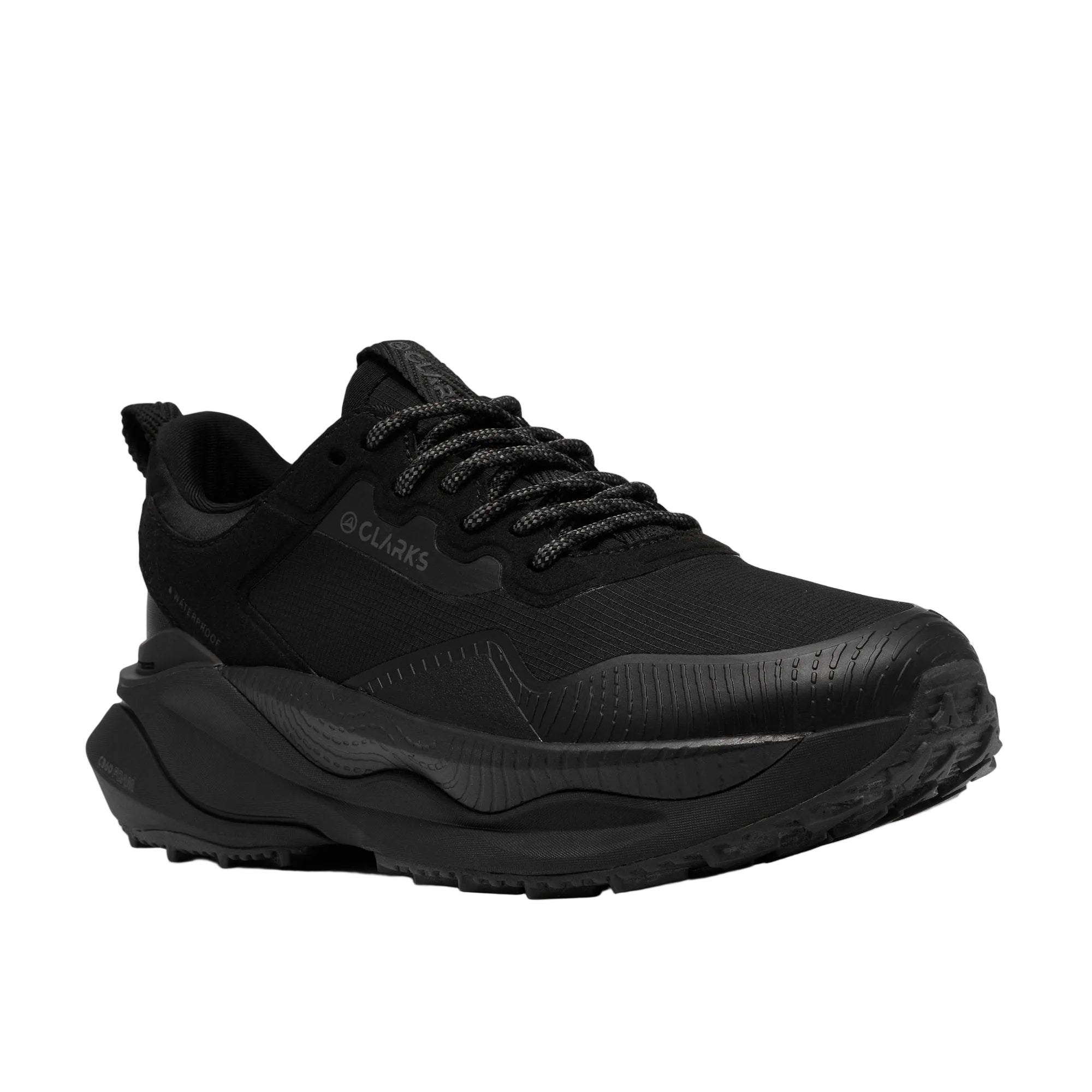 Outsole of the CLARKS Women's Pace Trail Go Waterproof Black/Black shoe, chunky C-tread rubber lugs.