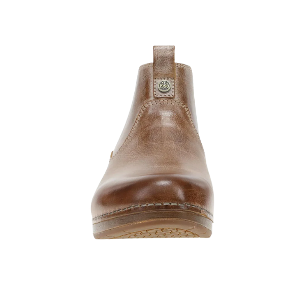 Front view of Dansko Women's Michelle Tan Waxy boot with visible stitching, pull tab, and slip-resistant sole.