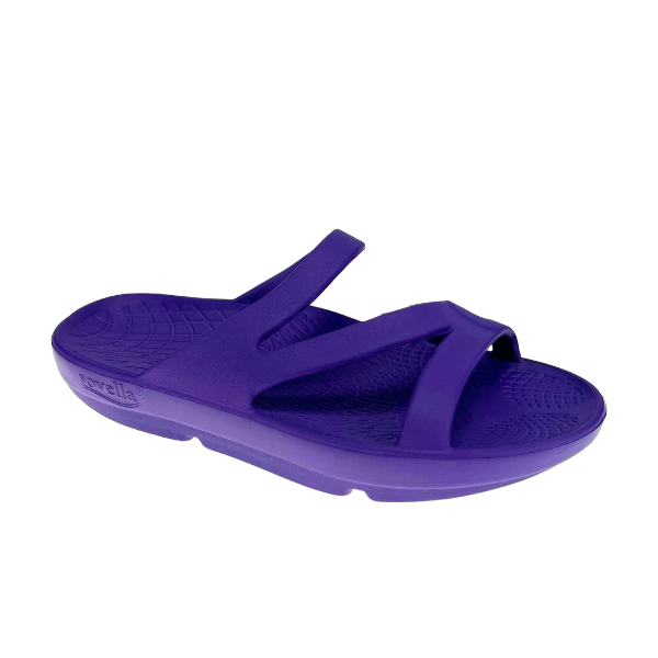 The Sovella Womens PF Slide Purple by SOVELLA is a single comfort recovery sandal with arch support, a molded footbed, and two diagonal top straps, displayed on a plain white background.