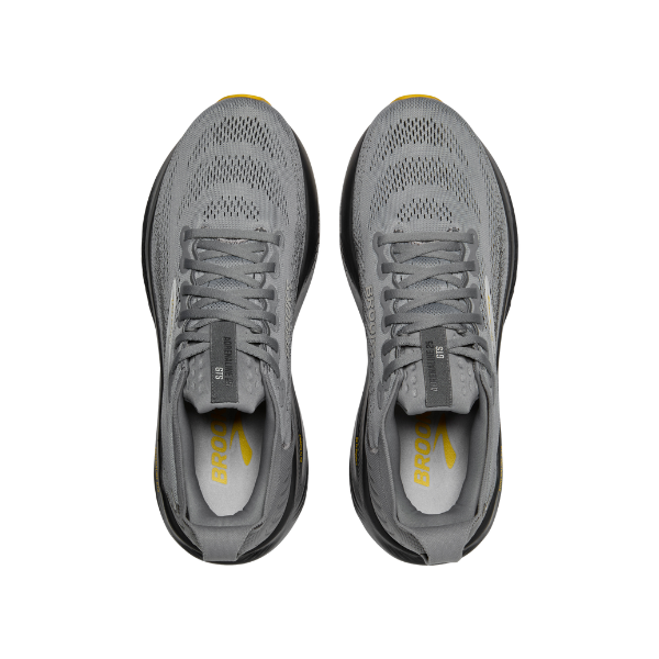 The BROOKS Men's Adrenaline GTS 25 Wide in Grey features white soles and yellow insoles—shown from above on a white background—offering ideal support for plantar fasciitis.