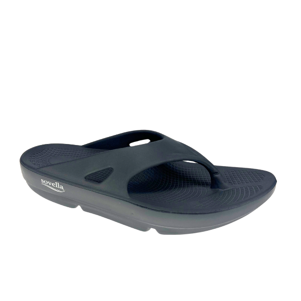 A dark grey SOVELLA Mens PF Thong sandal with a thick sole, enhanced arch support, textured footbed, Wide top strap, and visible brand logo on the side.
