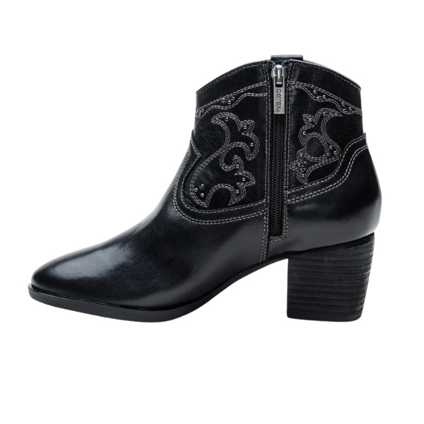 The Aetrex Women's Reagan Heel Boot Black by AETREX WORLDWide INC features black leather ankle boots with a chunky heel, arch support, decorative stitching, and a side zipper.