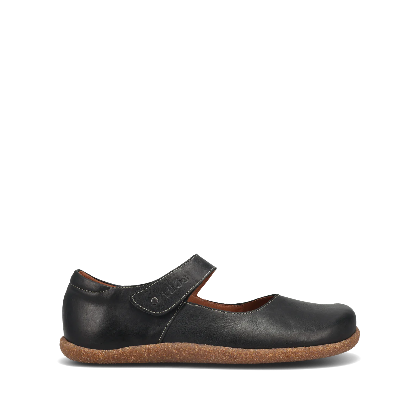 The TAOS Taos Womens Ultimate Black is a black Mary Jane shoe with a hook-and-loop strap, brown inner lining, Curves & Pods footbed, and textured cork sole, shown in side profile on a white background.