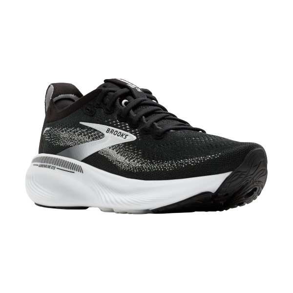 The BROOKS Women's Adrenaline GTS 25 Wide Black/White features a black mesh upper with white and gray accents, a thick white sole, and textured black outsole—designed for support and comfort, even for those with plantar fasciitis.