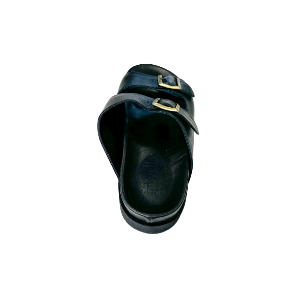 A top view of a single SOVELLA Womens Olivia Black sandal with two straps and gold buckles, designed for arch support and foot pain relief, against a white background.