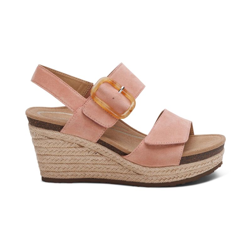 The Aetrex Womens Ashley Espadrille Wedge Rose by AETREX features pink suede, a cork footbed, braided jute platform, Wide straps, and a large tan buckle with arch support—ideal for those seeking plantar fasciitis shoes.
