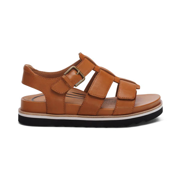 Aetrex Womens Romy Ginger by AETREX WORLDWide INC features tan leather, three adjustable Velcro straps with a buckle, cushioned footbed for comfort, and a black rubber sole with white midsole trim.