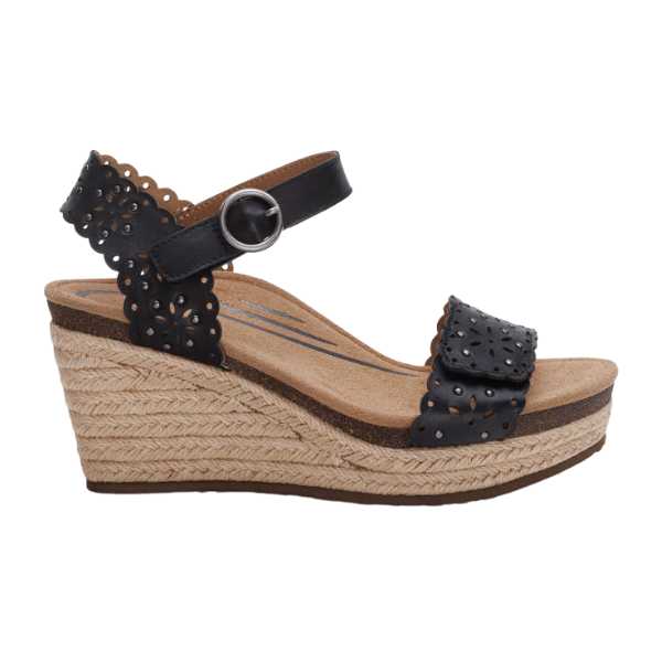 The Aetrex Womens Sydney Black Cutout sandal by AETREX WORLDWide INC features scalloped, perforated leather straps, a silver buckle, tan jute-wrapped platform sole, cork and memory foam footbed for arch support, and an open toe design.