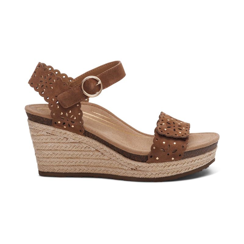 The Aetrex Womens Sydney Scotch Cutout sandal by AETREX WORLDWide INC features perforated ankle and toe straps, buckle closure, braided jute platform sole, and a memory foam footbed for comfort.