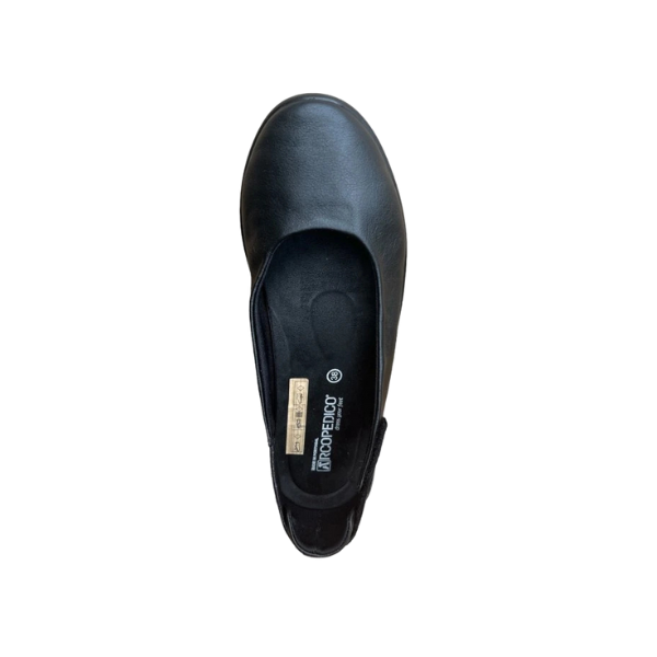 The Arcopedico Womens Jasmund Black by ARCOPEDICO is a black vegan ballerina flat with a round toe, cushioned insole with brand labels, and Twin Arch Support, shown from above on a white background.