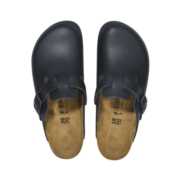 Top view of Birkenstock Mens Boston Pro Leather Black clogs by BIRKENSTOCK, featuring closed toes, buckled side straps, tan cork footbeds, and slip-resistant outsoles, shown side by side on a white background.