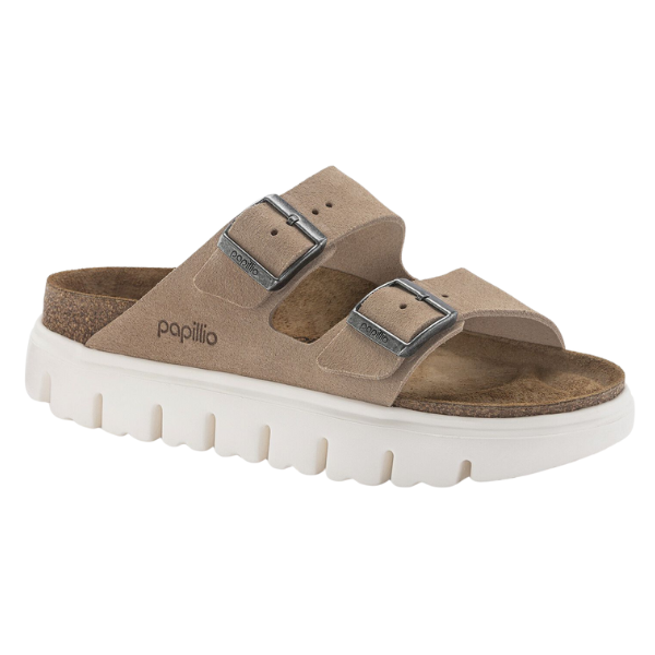 The Birkenstock Womens Arizona Chunky Sand is a tan suede sandal with two adjustable buckled straps, a contoured footbed, and a thick white ridged rubber sole. The BIRKENSTOCK logo appears on the side.