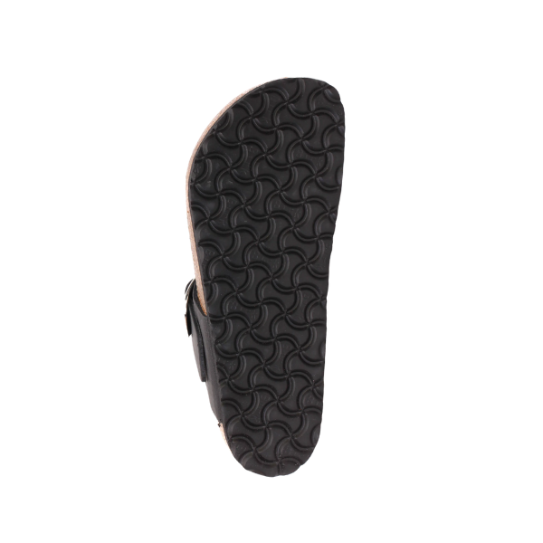 The image displays the black rubber sole with a wavy texture on the BIRKENSTOCK Womens Gizeh Big Buckle Oiled Leather Black sandal, shown sole-up against a white background.