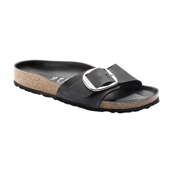 The Birkenstock Womens Madrid Big Buckle Black sandal features a Wide oiled nubuck strap, large silver buckle, signature cork footbed, and a black textured sole.
