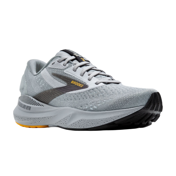 The BROOKS Mens Adrenaline GTS 24 Wide Grey running shoe features a mesh upper, GuideRails® support, cushioned sole, and a textured outsole for grip, all in gray with black and yellow accents.