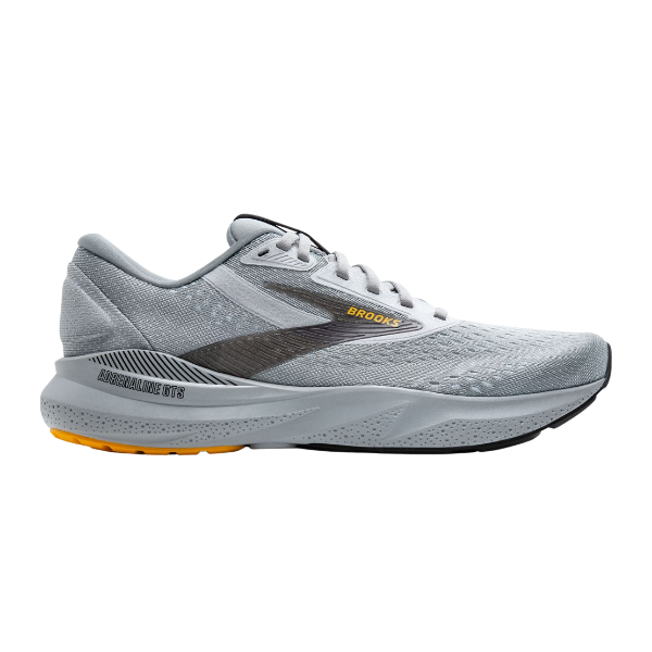The Brooks Mens Adrenaline GTS 24 Wide Grey running shoe features a light gray mesh upper, black and yellow sole, black accents, yellow BROOKS branding on the side, and trusted GuideRails® support.