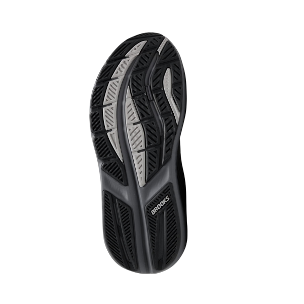 The Brooks Men’s Ghost Max 3 Wide Grey by BROOKS features a black and gray textured, patterned sole with “Brooks” near the heel—perfect for those seeking foot pain relief in wide running shoes. Shown on a white background.