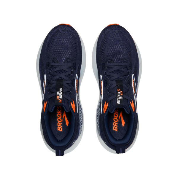 The BROOKS Mens Glycerin GTS 22 Navy running shoes, seen from above with orange accents and white midsoles, feature BROOKS branding—ideal comfort for those with plantar fasciitis.