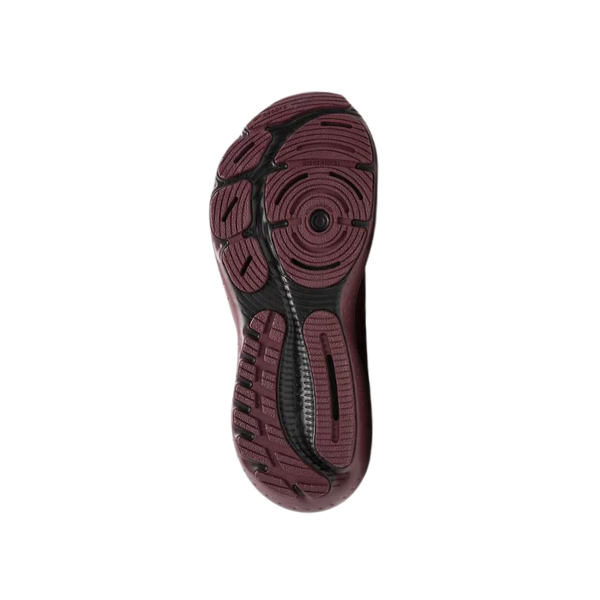 The image displays the maroon rubber sole with black accents of the BROOKS Mens Glycerin Stealth Fit 21 (Truffle/Black, style 110421-699), highlighting its textured tread for grip and traction, set against a plain white background.