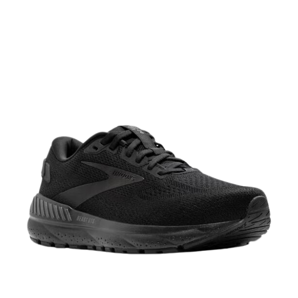 The BROOKS Mens Beast GTS 24 Wide Black is a black running shoe with a mesh upper, lace-up closure, textured rubber sole, and GuideRails® support system, shown at an angle on a white background.