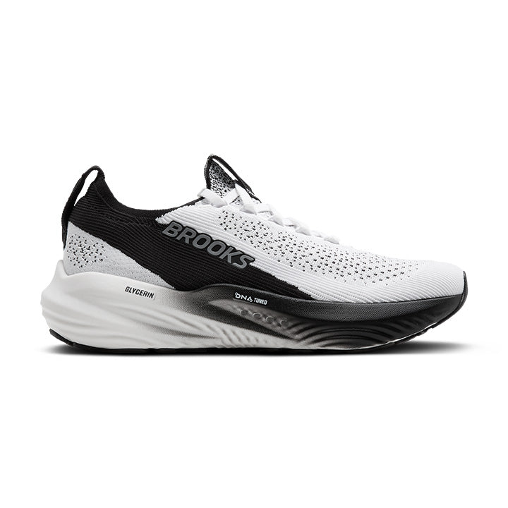 The BROOKS Womens Glycerin StealthFit 22 White/Black features DNA-tuned cushioning, a breathable mesh upper, gradient midsole, wavy-patterned sole, and Brooks branding on the side.