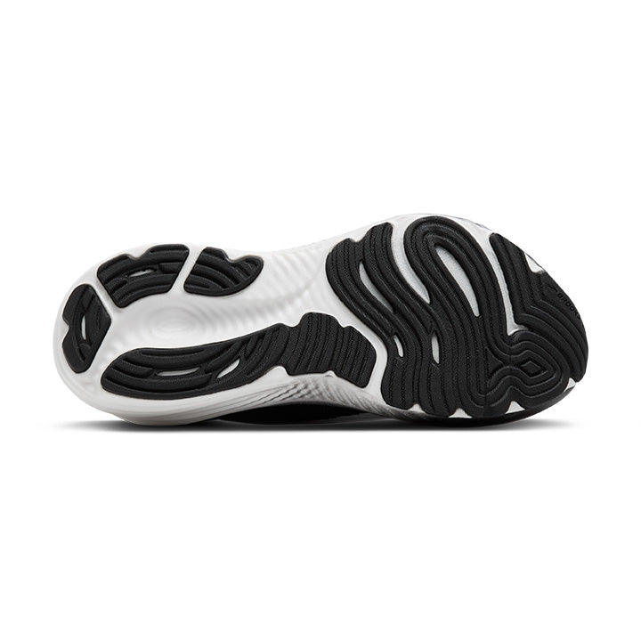 The image displays the sole of the BROOKS Womens Glycerin StealthFit 22 White/Black, featuring a wavy black and white rubber pattern with a DNA tuned midsole engineered for enhanced traction and grip.
