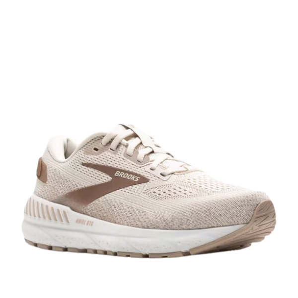 The BROOKS Womens Ariel GTS 24 Wide Coconut is a beige and light brown running shoe with a white sole, mesh upper, lace-up design, Brooks logo on the side, GuideRails support system for maximum support. Shown on a plain white background.
