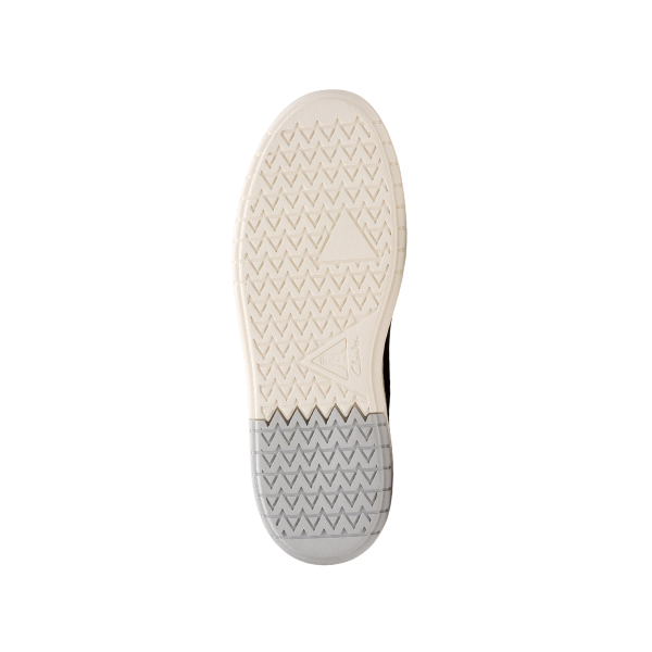 The image displays the white and gray sole of the CLARKS Mens Courtlite 2 Run Black sneaker, featuring a zigzag tread and triangular accents near the arch and heel, set against a plain white background.