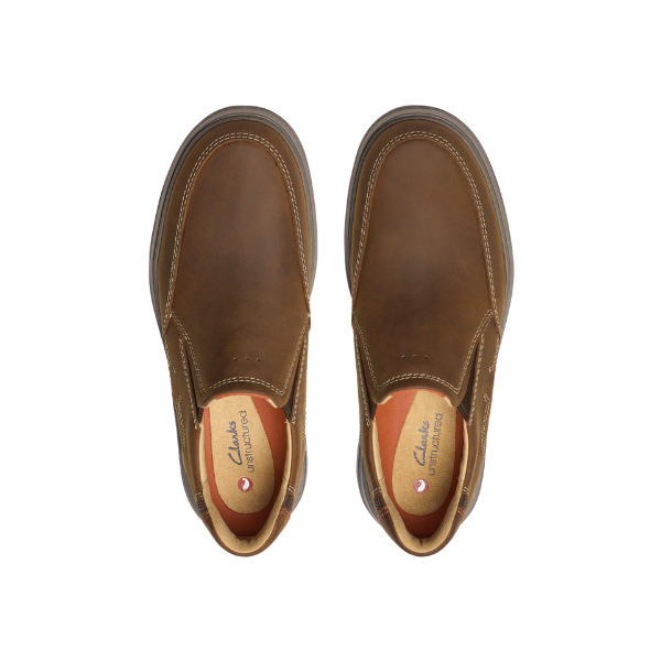 Top view of CLARKS Mens Un Briley Step Wide Beeswax shoes in brown leather, showing visible stitching and cushioned insoles, placed side by side on a white background.