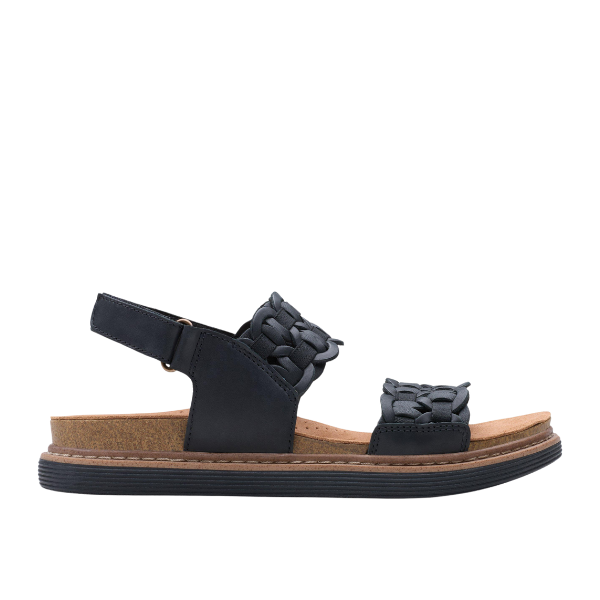 The Clarks Womens Arwell Glide Wide Black sandal features black nubuck, a cork Contour Cushion footbed, adjustable ankle strap, and two woven straps across the top, shown from the side on a white background.