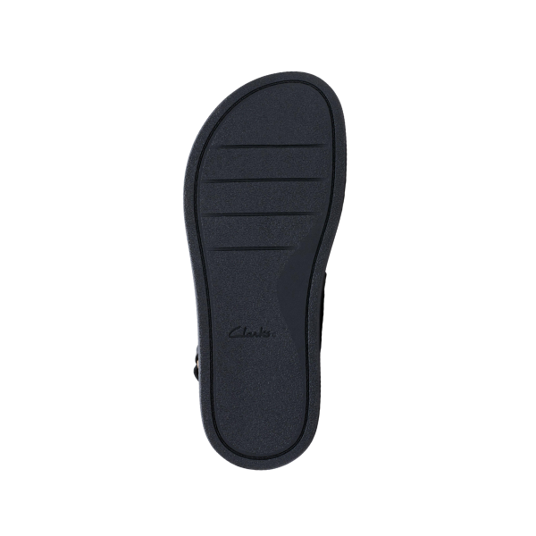 The image displays the black TPR rubber sole of the Clarks Womens Arwell Glide Wide shoe, featuring three horizontal grooves near the toe and a central embossed CLARKS logo, against a plain white background.