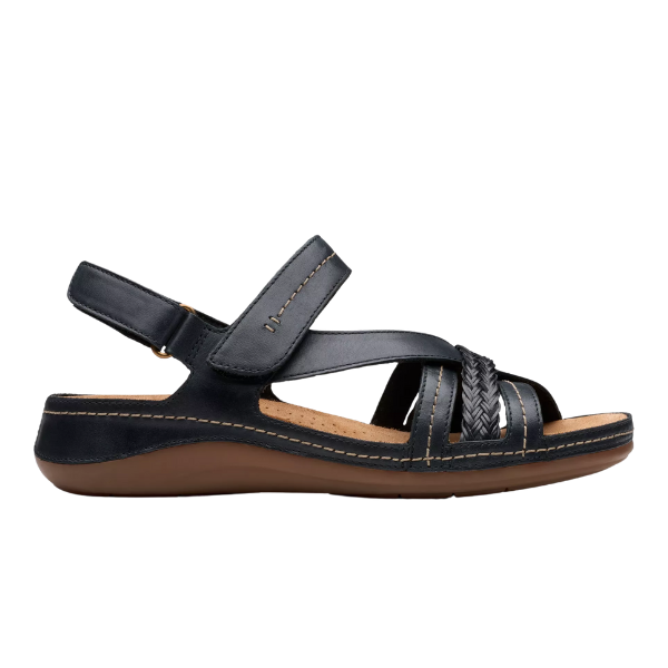 The CLARKS Womens Cecily Strap Leather Wide Black Combo sandal features a low wedge heel, adjustable Velcro straps, braided front detail, tan stitching, Contour Cushioned footbed, and a durable brown rubber sole.