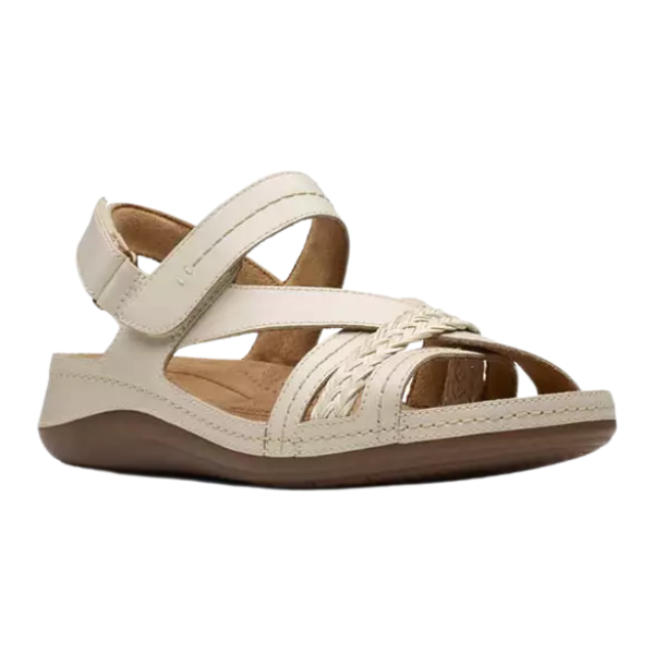 The Clarks Womens Cecily Strap Leather Wide Cream sandal features cream leather with crisscross and braided straps, a velcro ankle strap, and a contoured cushioned footbed for comfort.
