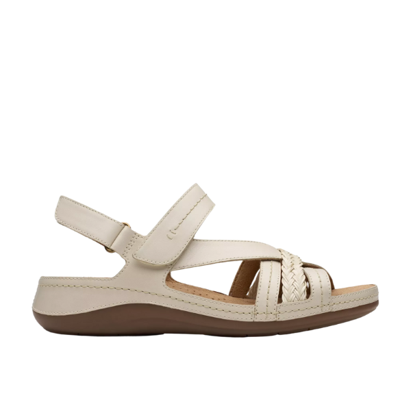 The Clarks Womens Cecily Strap Leather Wide Cream sandal by CLARKS features a cream leather upper, cushioned footbed, hook-and-loop backstrap, brown low sole, and woven top detailing for all-day comfort.