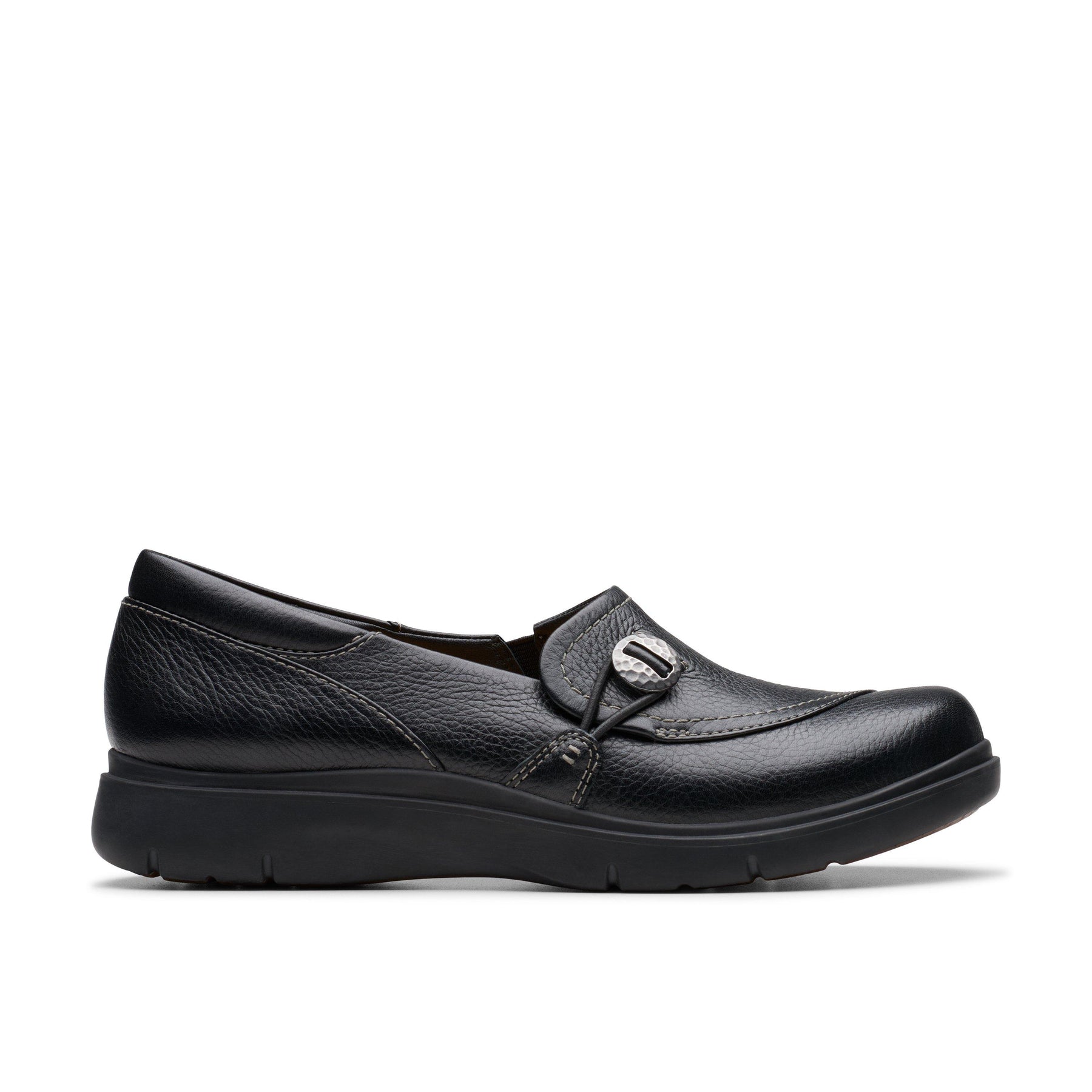 The CLARKS Clarks Womens Certina Ease Wide Black loafer features black leather, a rounded toe, decorative stitching, a silver buckle detail, and a thick textured rubber sole for extra comfort and support.