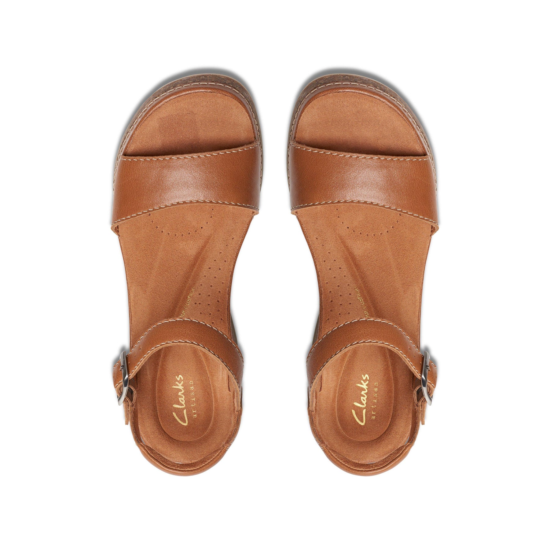 A pair of CLARKS Womens Kassandra Lily Wide Tan sandals with ankle straps and open toes, featuring a Contour Cushion footbed, shown from above on a white background.