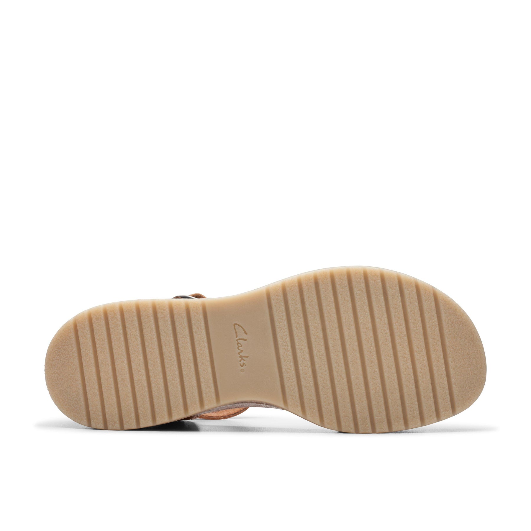 Bottom view of the Clarks Womens Kassandra Lily Wide Tan sandals beige rubber sole with horizontal grooves and the CLARKS logo in the center, featuring a Contour Cushion footbed for all-day comfort.
