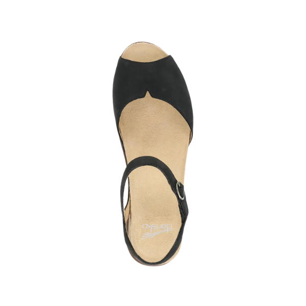 Top view of the Dansko Womens Cass Black Nubuck sandal by DANSKO, featuring a black open-toe design, tan insole with logo, slingback strap and buckle, plus cork midsole for foot pain relief.