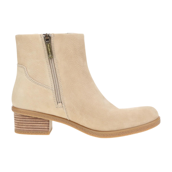 The Dansko Womens Daisie Waterproof Sand ankle boot by DANSKO features beige suede, a low stacked heel, side zipper, round toe, and Natural Arch technology. Shown in a side profile on a plain white background.